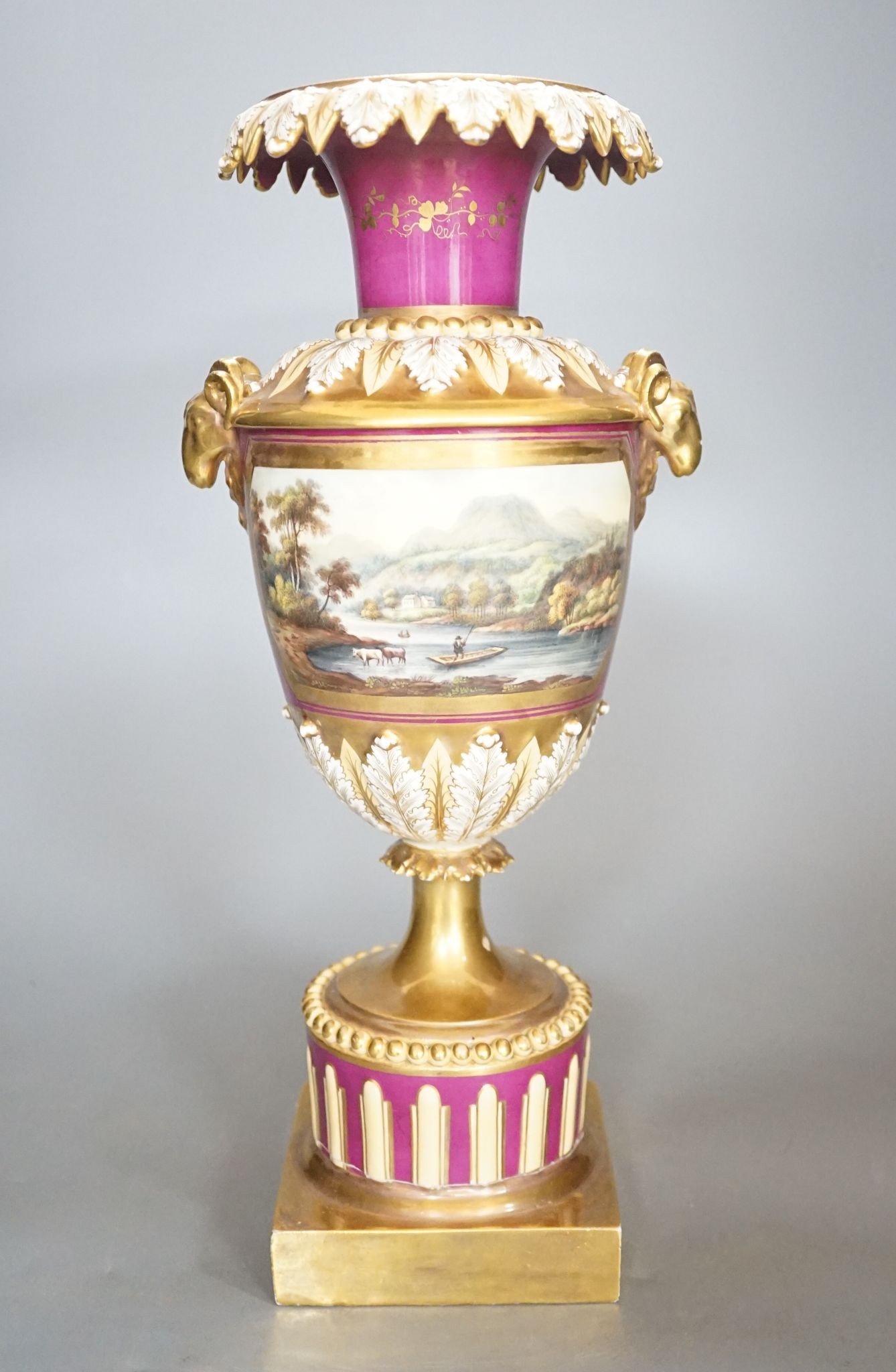 A 19th century English porcelain vase painted with a landscape on crimson ground, Worcester? 35cm